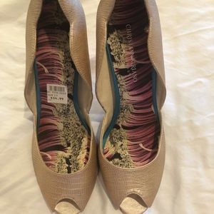 Gold heels by Christian Siriano